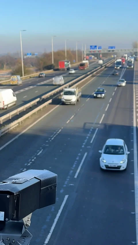 Vertical. Black camera watching motorway traffic, time lapse Видео 296536387