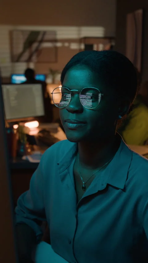 Vertical of Black Female Developer Coding with Code Reflection in Glasses Stock Footage 336717260