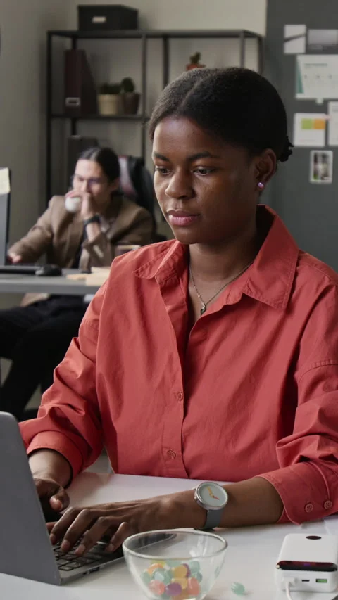 Vertical of Black Female Programmer Working on Laptop in Diverse Office Stock-Footage 336708025