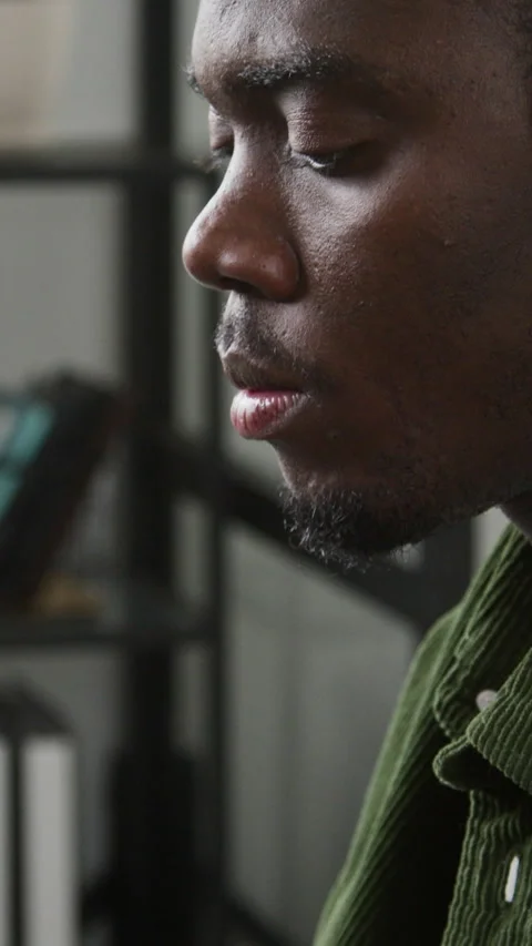Vertical of Black Male Web Developer Smiling while Working on Project Stock Footage 335937977