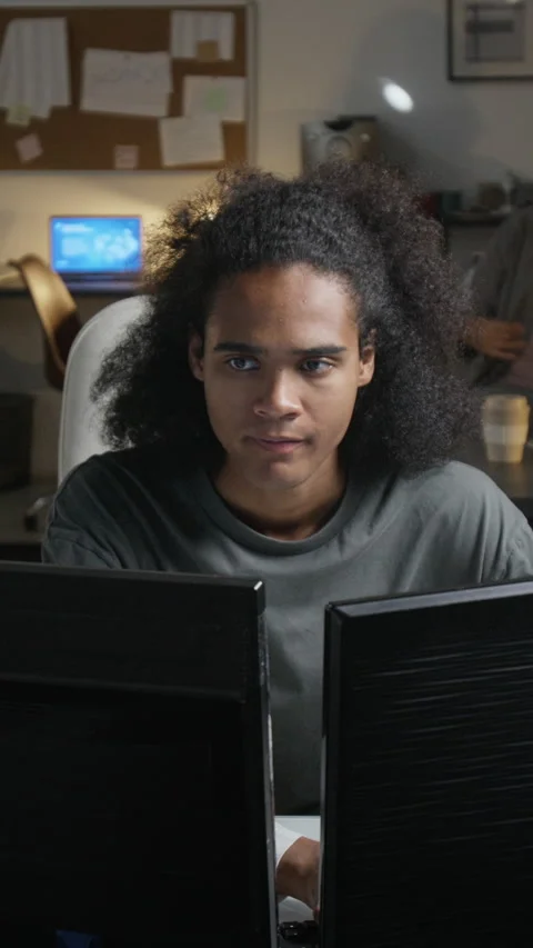 Vertical of Black Man Experiencing Headache While Working on Computer Stock Footage 348141690