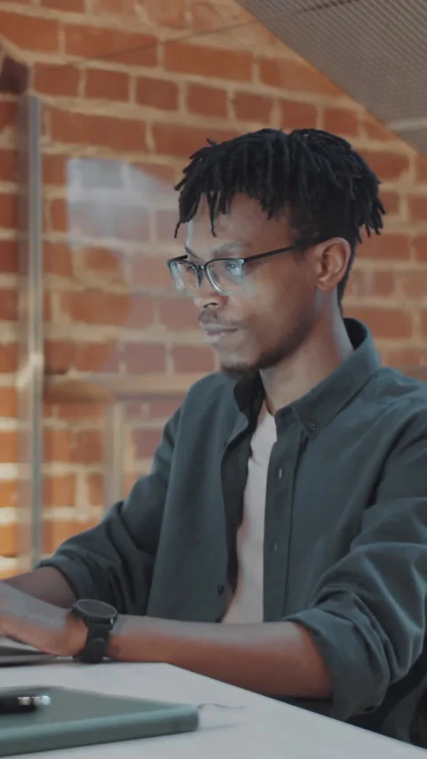 Vertical of Black Millennial Programmer Developing Software on Laptop in Office 스톡 동영상 322634012