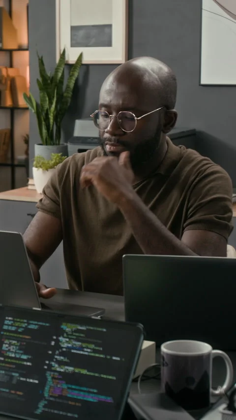 Vertical of Black Programmer Developing Software Product Working on Laptop Stock Footage 329617618