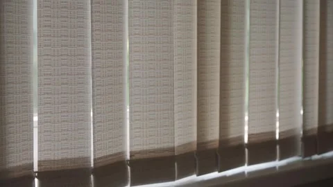 Vertical blinds block out sunlight. Inside view. Stock Footage 243187426