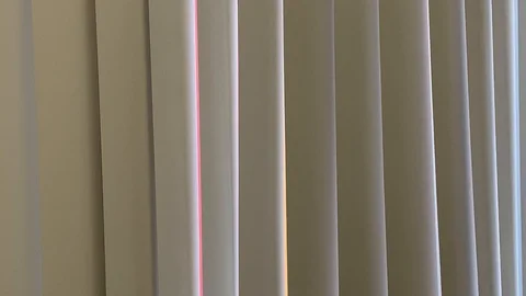 Vertical blinds undulate from soft air movement 스톡 동영상 114497130