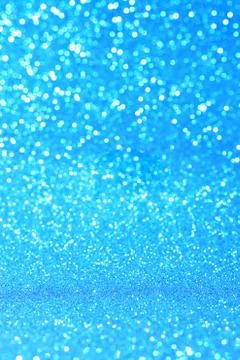 Vertical blue glitter background with blur and bokeh Stock Photos