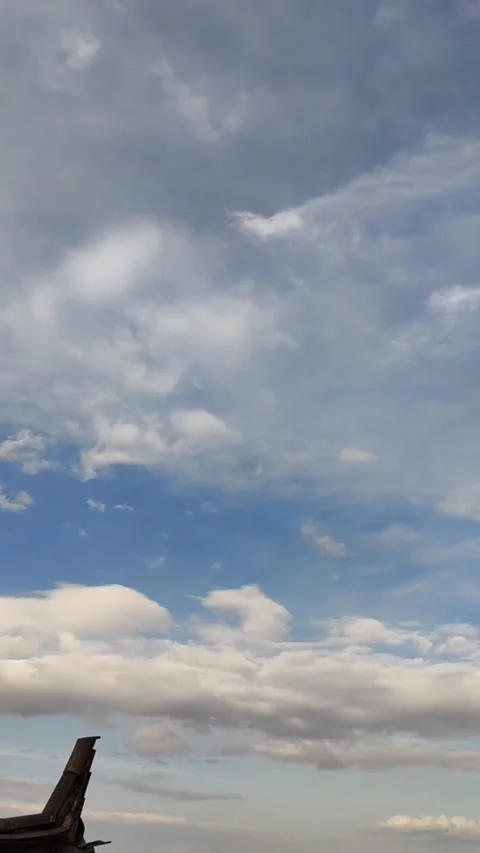 Vertical Blue sky and fast moving white clouds time lapse Dali China Видео 333772964