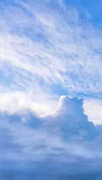 Vertical Blue Sky with Dramatic Layered Clouds Stock Photos