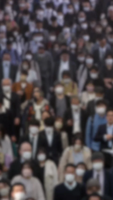 Vertical blurry crowd of pedestrians walking in same direction Stock Footage 320476860
