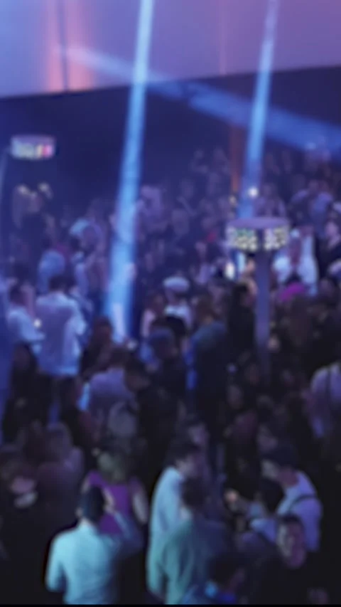 Vertical blurry video of the dancing mass of people at a disco in the club Stock Footage 301543047