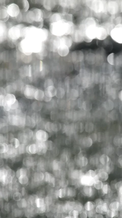 Vertical bokeh of a flowing river Stock-Footage 336829343