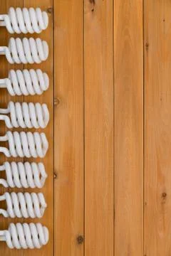 Vertical border of energy efficient light bulbs Stock Photos
