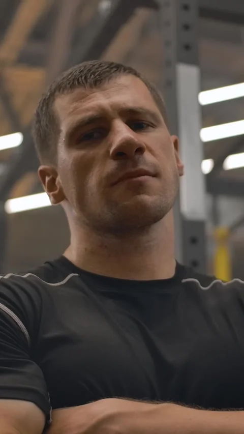 Vertical of Bottom-up panoramic portrait of a young strong caucasian athlete Stock Footage 276833854