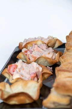 Vertical bottom of tapas with pink sauce and crab with natural tomato Stock Photos