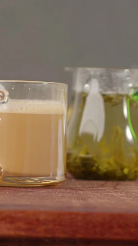 Vertical: Brewing instant coffee and oriental tea with hot water. Stock Footage 346502932