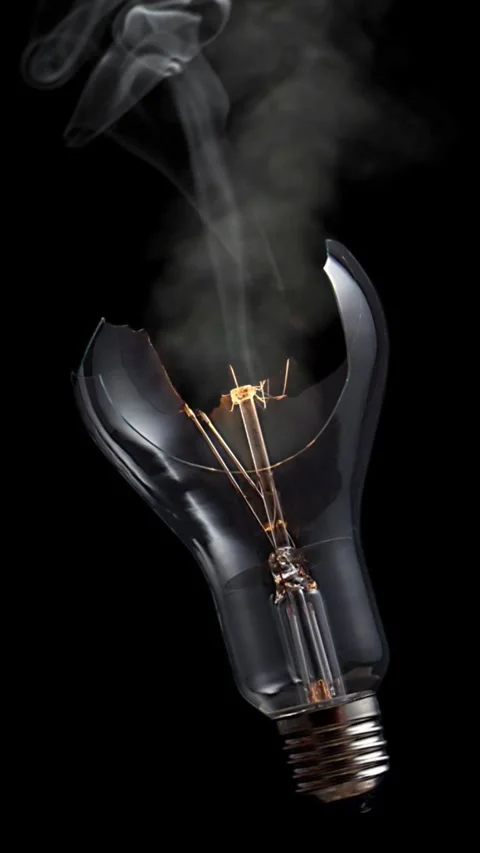 Vertical Broken Lightbulb Smoking 4K Loop Video stock 267619802