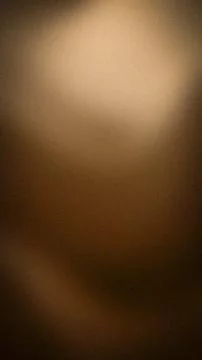 Vertical brown beige dark gradient background texture grainy blur wallpaper.. 스톡 사진