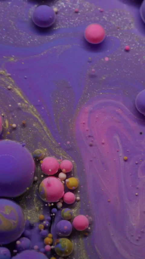 Vertical bubble spill paint mix oil drop glitter Stock Footage 314496305