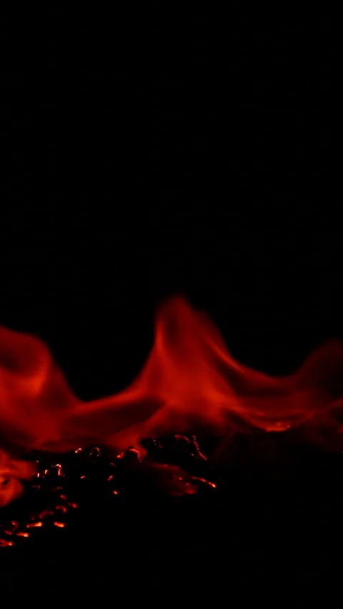 Vertical burning fire flame on ground isolated on black background, slow motion Stock Footage 308144091