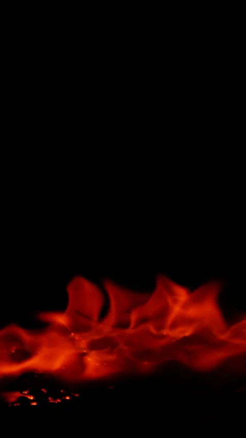 Vertical burning fire flame on ground isolated on black background, slow motion Stock Footage 308691790