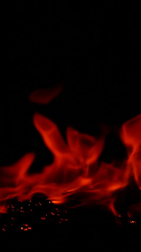 Vertical burning fire flame on ground isolated on black background, slow motion Stock Footage 310767965