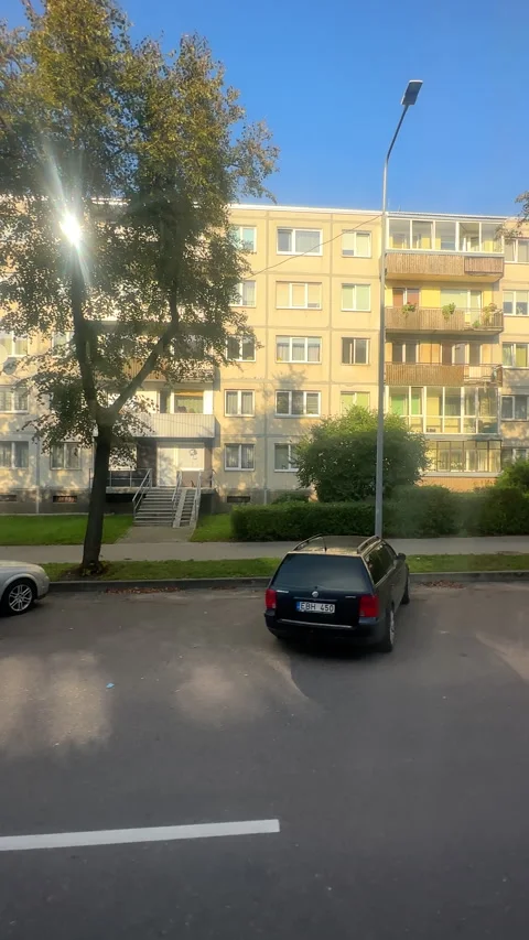 Vertical. Bus side window view of residential Greimo street in Siauliai city. Stock Footage 295985880