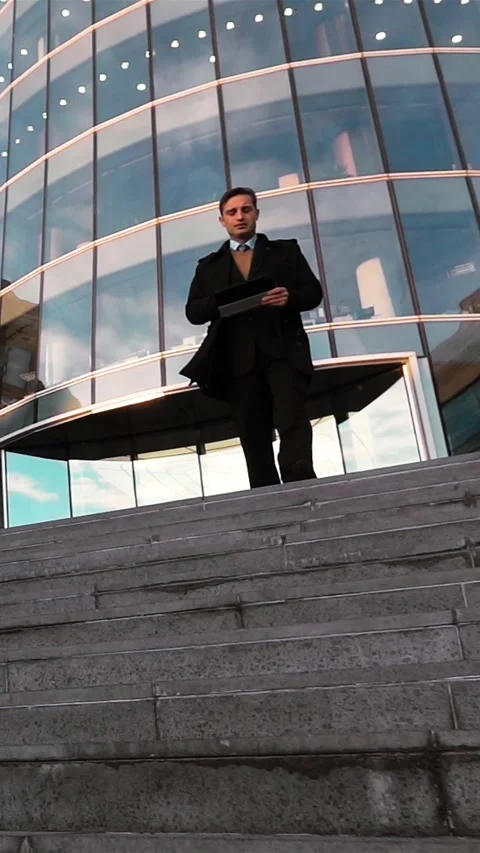 Vertical of Business man using digital pad outdoor Stock Footage 305515237