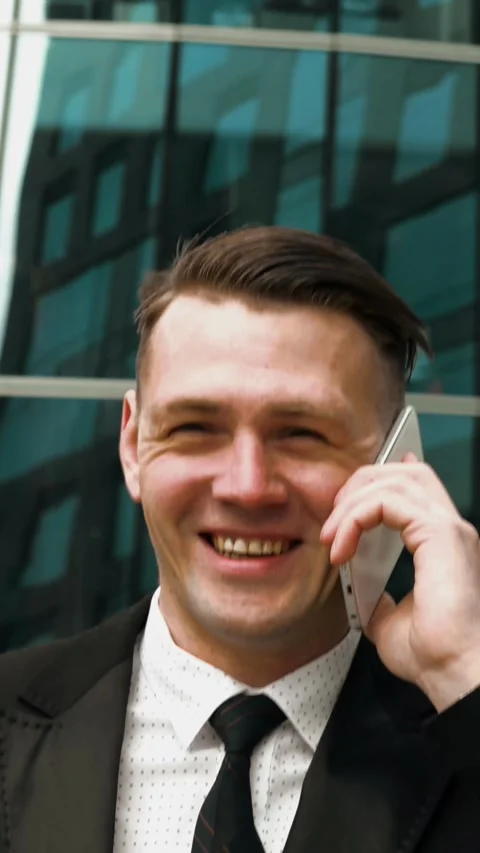 Vertical of Businessman talking with smartphone Stock Footage 305494844