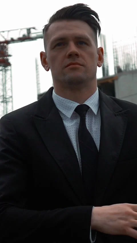 Vertical of Businessman using digital pad near new construction Stock Footage 305491870