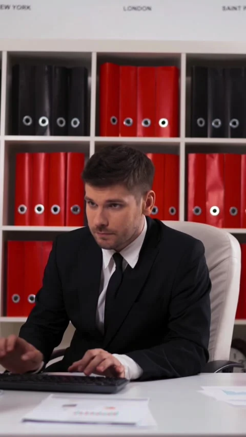 Vertical of Businessman working with computer in office Stock Footage 305482264