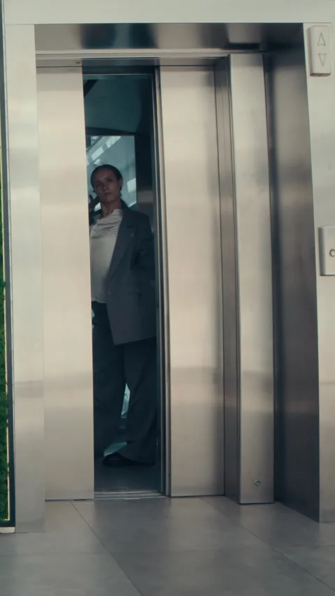 Vertical of Businesswoman Dancing in Elevator Stock Footage 287159316