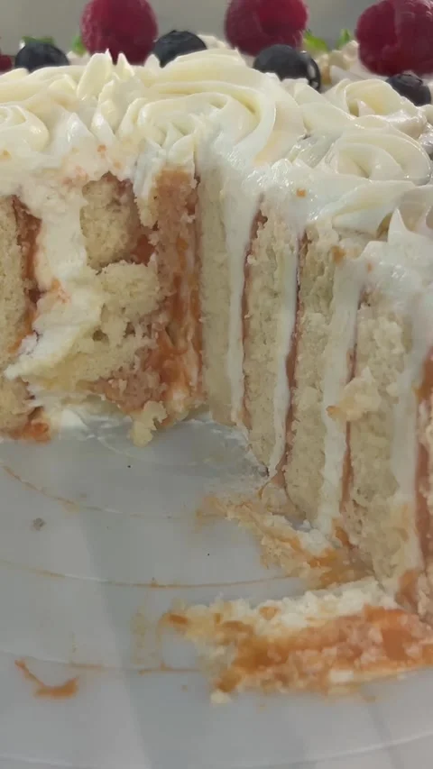 Vertical cakes slice of pink colored puff cake for a birthday celebration Stock Footage 312015485