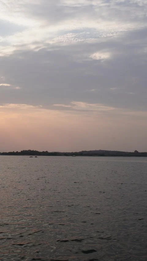 Vertical Calm Water and Sunset Clouds Stock Footage 335802021
