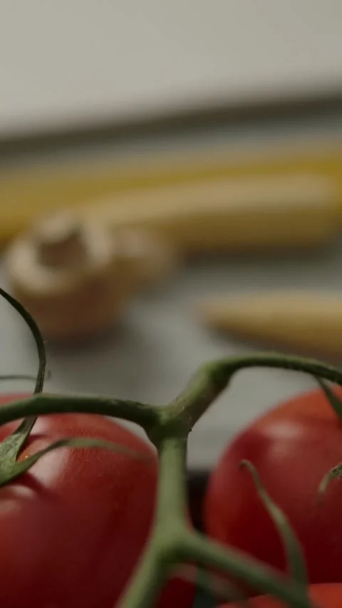 Vertical of Camera moving forward to empty notepad amidst pasta ingredients Stock Footage 276919717