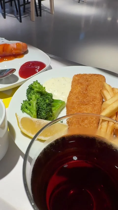 Vertical Camera Pan Shot Across Meal Tray With Fish Steak French Fries Soda Coff Stock Footage 346596651