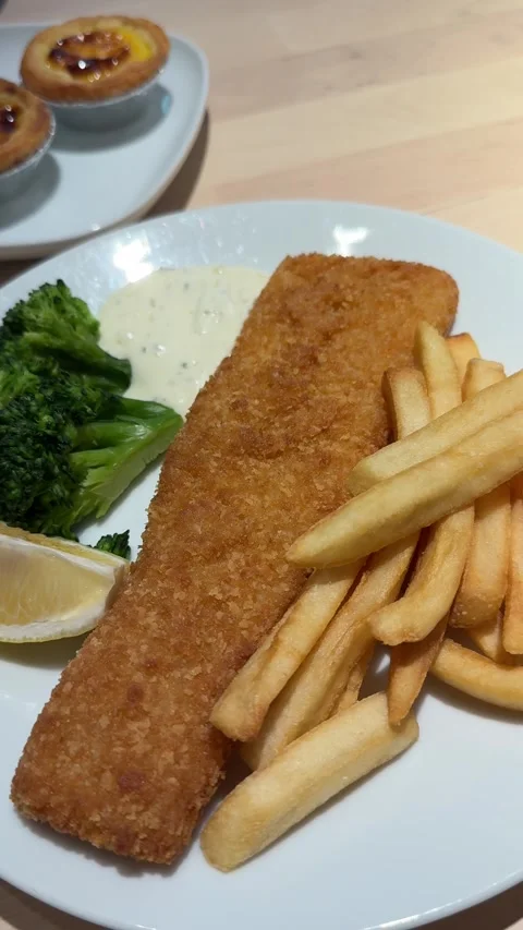 Vertical Camera Push In Shot Of Fried Fish Steak With French Fries Lemon And Sau Stock Footage 346596663