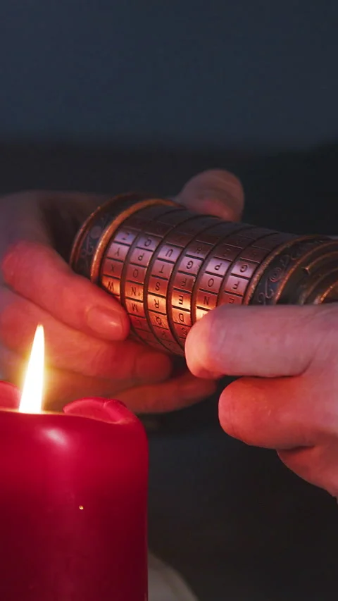 Vertical Candlelit Macro of Hands Solving Cryptex Code, Dark Mystery Scene Stock Footage 334358758