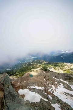 Vertical capture of epic landscape view on top of mountain resort Photos