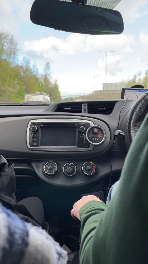 Vertical. Car interior view driving on highway under pedestrian bridge. Vídeos de archivo 273052829