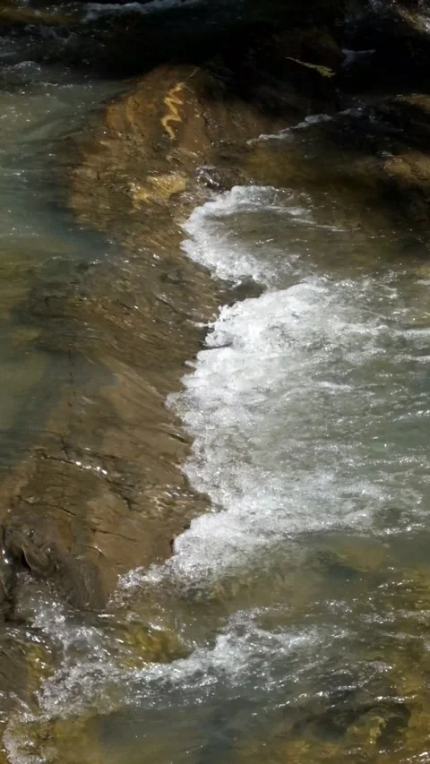 Vertical Cascade of a mountain river Stock Footage 336843557