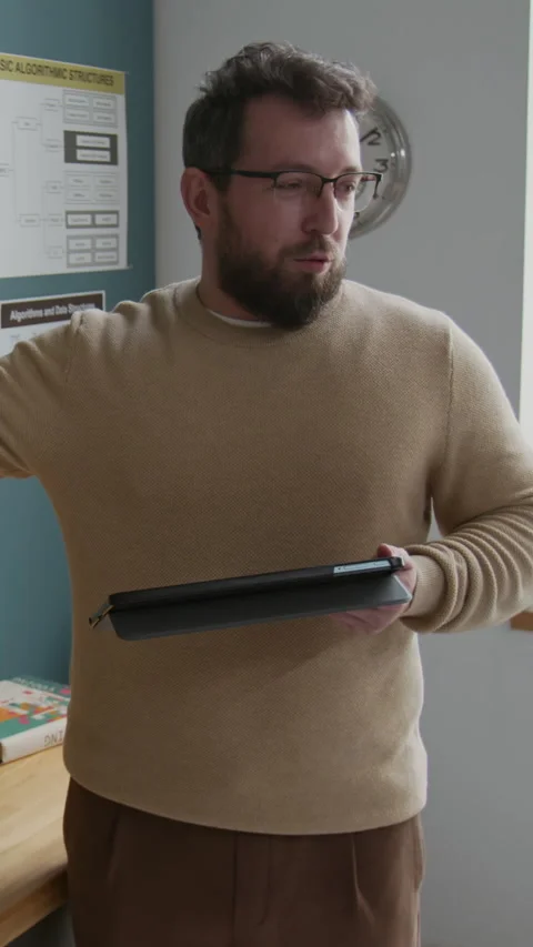Vertical of Caucasian Male Coding Teacher Explaining Algorithm at Lesson Stock Footage 318728628