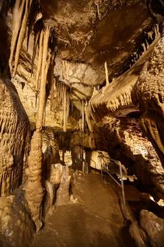 Vertical cave detail of formations on path stalagmites and stalactites Stock-Fotos
