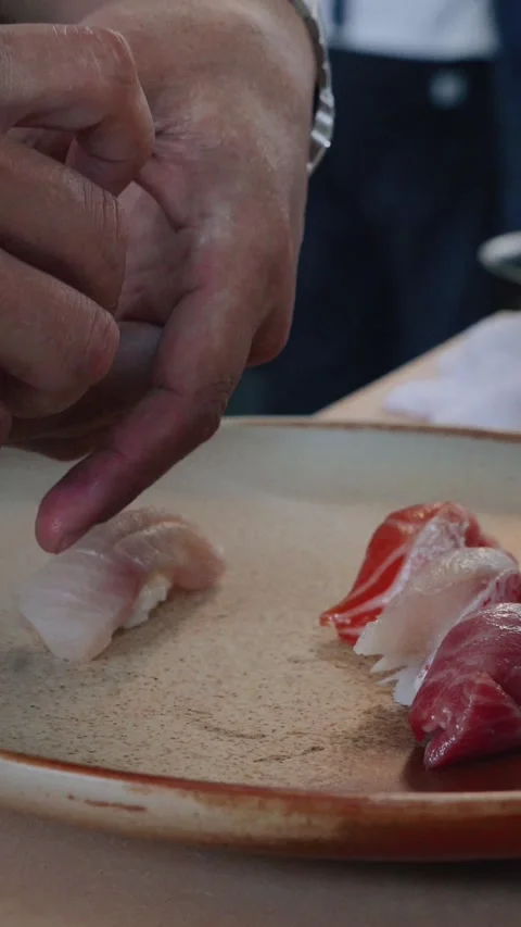 Vertical chef plating nigiri assortment closeup Stock Footage 317456903