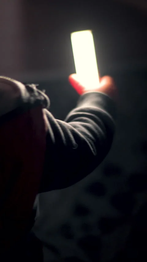 Vertical Child Hand With Night Light Illuminating Darkness In Dark Bedroom Video stock 330971094