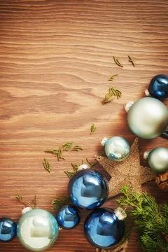 Vertical Christmas backdrop with border of your balls, stars and green branches Stock Photos