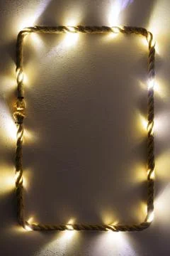 Vertical Christmas frame with string lights Stock Photos
