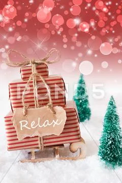 Vertical Christmas Sleigh On Red Background, Text Relax Stock Photos