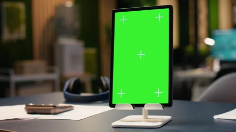 Vertical chroma key screen tablet in contemporary empty office workspace Stock Footage 334044447