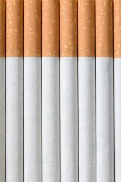Vertical cigarettes background Stock Photos