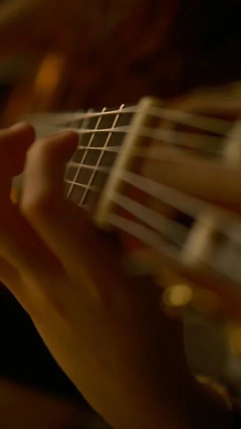 Vertical, Cinematic light, hands playing classic guitar Stock Footage 318950160